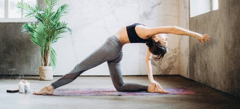 a girl doing yoga at home