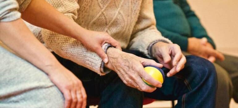 an elderly couple holding hands