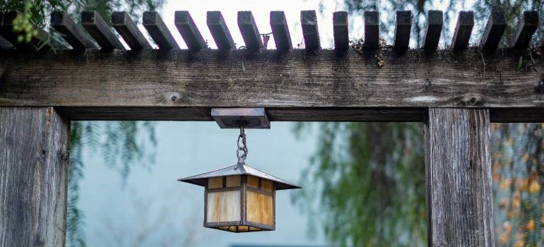 Hanging outdoor lantern can help make your home more secure with landscaping