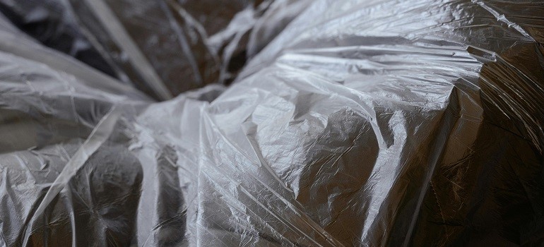 plastic covers on a leather sofa