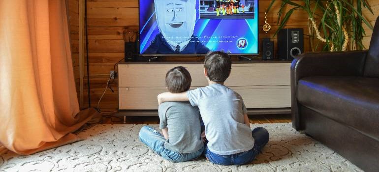 Kids watching TV together