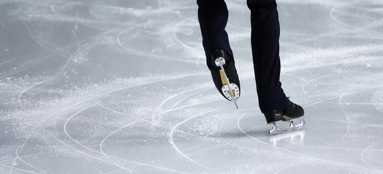 a man ice skating at a rink