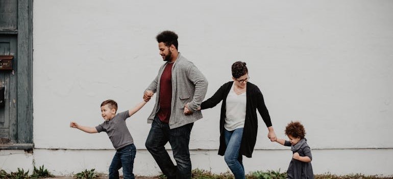 Family walking hand in hand together