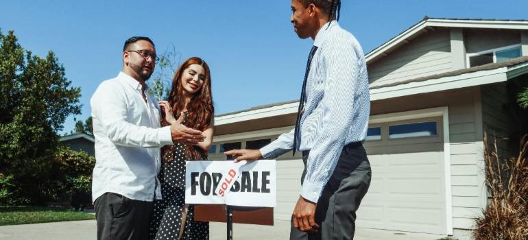 Couple with agent showing essential checks before buying a home in Sunnyvale