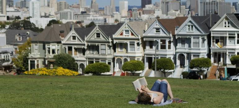 : Dolores Park with views of Victorian homes in affordable neighborhoods in San Francisco.