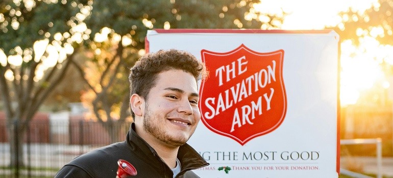 Salvation Army worker helps people donate unwanted items during a move.