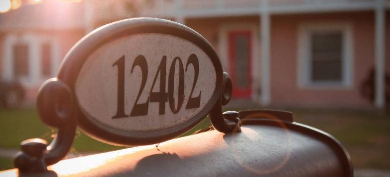 Mailbox with address plaque at sunset