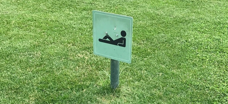A park sign for lying down