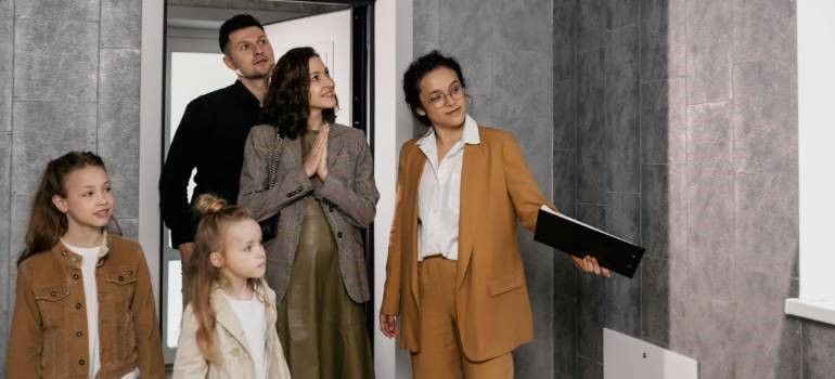 Family touring a home with realtor who is explaining Fremont housing market trends for October 2025