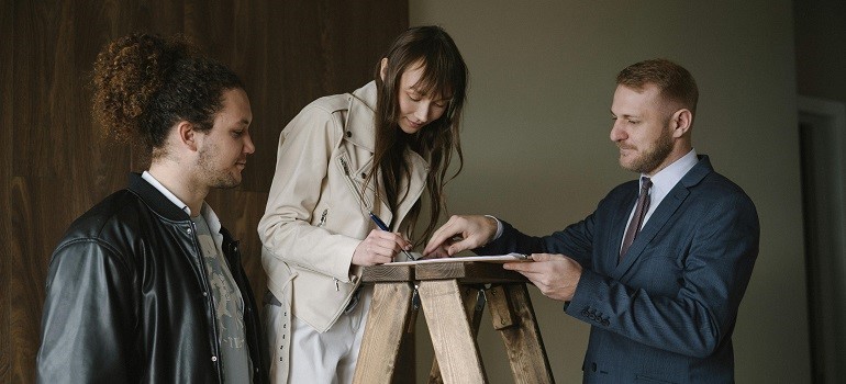 Couple signing real estate papers