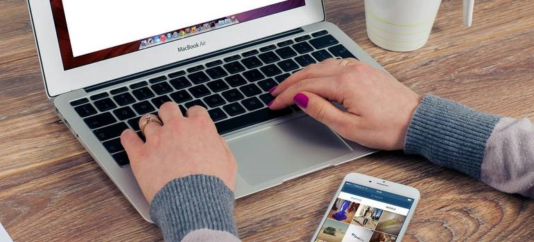 a person typing marketing reports about fake reviews on social media