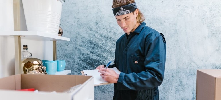 a man looking at some chart and checking some boxes 