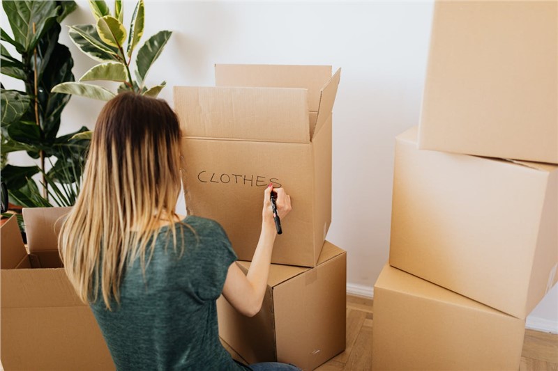 a woman sorting the boxes 