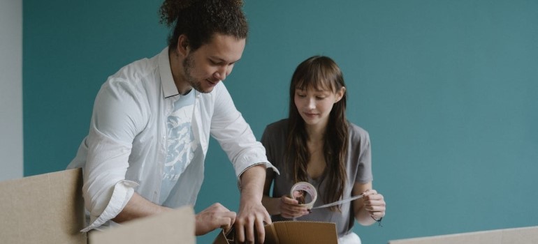 Happy couple getting ready for the arrival of movers Fremont CA offers