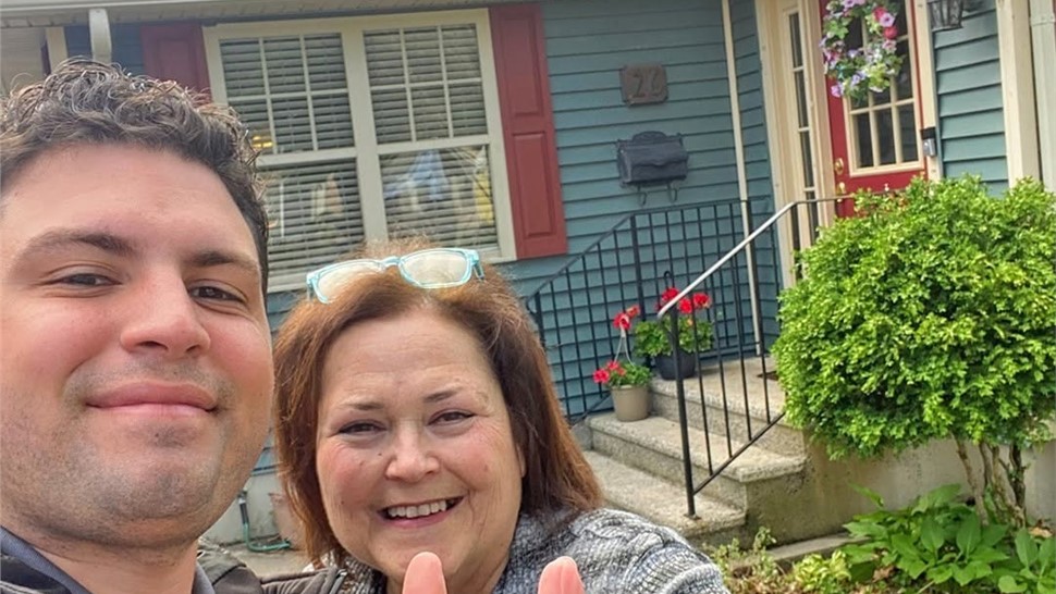 Close-up of happy homeowner after Warner Exteriors roofing project