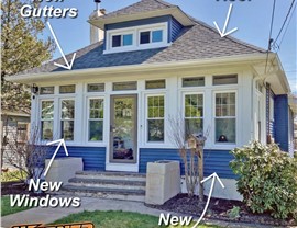 New windows, new gutters, new siding, and new roof installed on blue home in New Jersey by Warner Exteriors & Solar