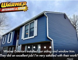 Customer review graphic showing blue home siding and window installation completed by Warner Exteriors.