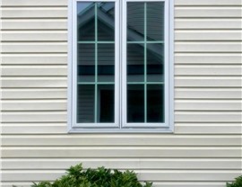Single ProVia window installed on tan vinyl siding home in New Jersey by Warner Exteriors