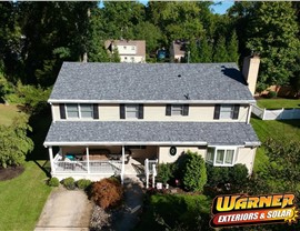 New Slatestone Gray Owens Corning roof installed by Warner Exteriors on two-story NJ home