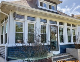 Row of newly installed ProVia windows on blue and white home with fresh siding in New Jersey