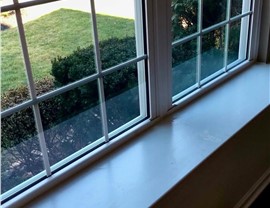 Interior view of new ProVia vinyl windows showing natural light and updated window sill in New Jersey home