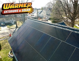 Residential solar panel installation on shingle roof in Bensalem PA from elevated angle
