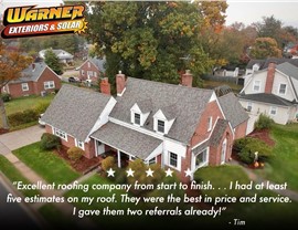 Aerial view of a home with new roof installation featured in a Warner Exteriors customer testimonial.