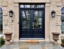 Black modern fiberglass entry door installation with sidelights in Cherry Hill, NJ