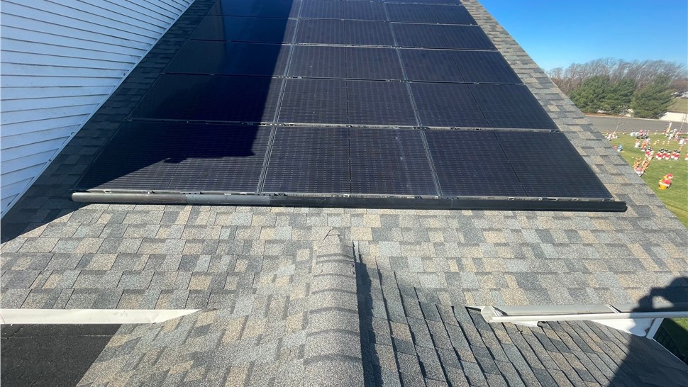 Solar panels reinstalled after roof replacement in Clarksboro NJ with OC Duration Peppercorn shingles