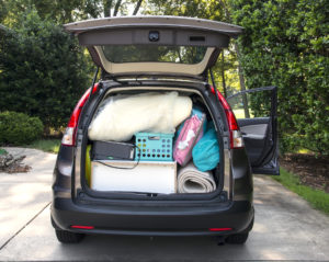 Van loaded full of student's possessions ready for moving into a college dorm