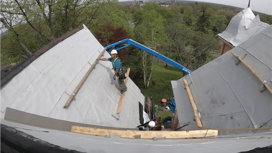 team fixing a roof