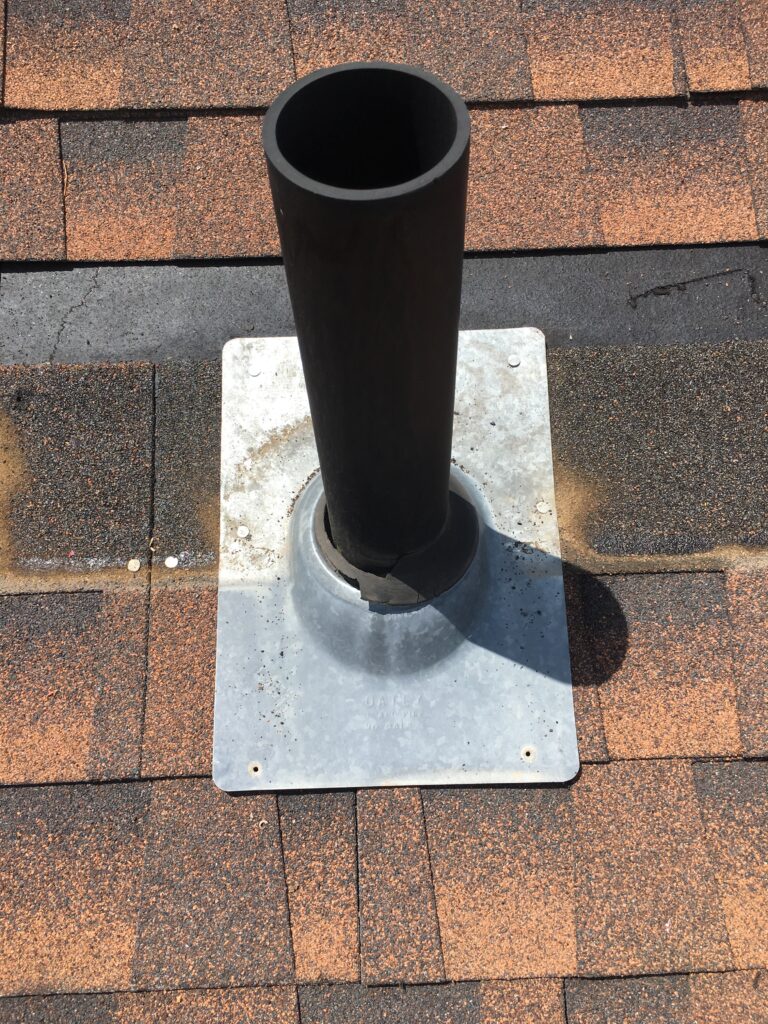 image shows an old pipe jack with the shingles removed as part of a boulder roof repair