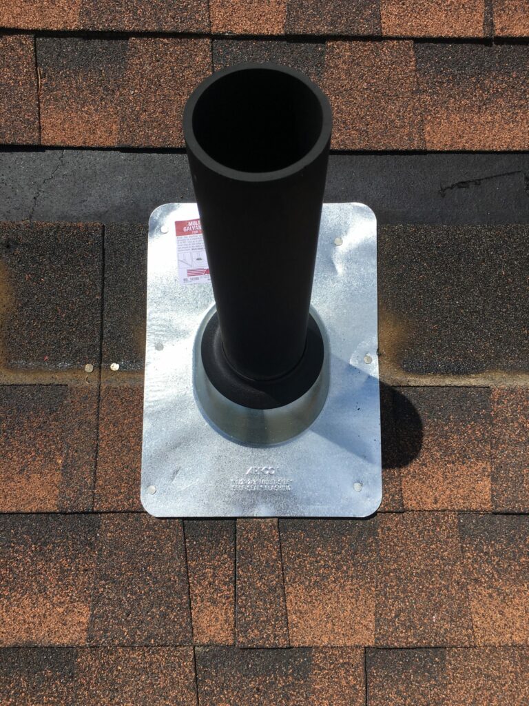image shows a new pipe jack installed with new pipe jack flashing on a boulder roof repair