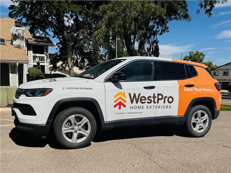 Branded vehicle with WestPro Home Exteriors Love Your Home Siding Roofing Windows
