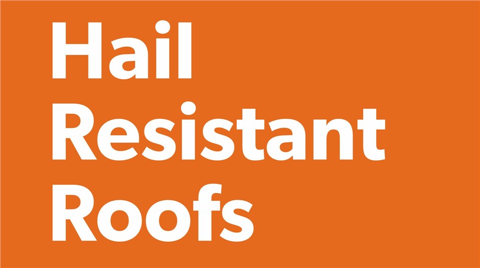 WestPro offers free roof damage inspections. Pictured is a WestPro roofer inspecting and repair a roof with hail damage.