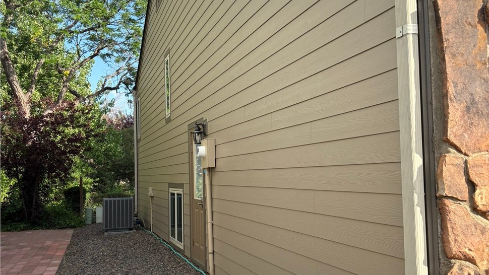 Wide angle view of completed James Hardie Lap siding install in Louisville Colorado