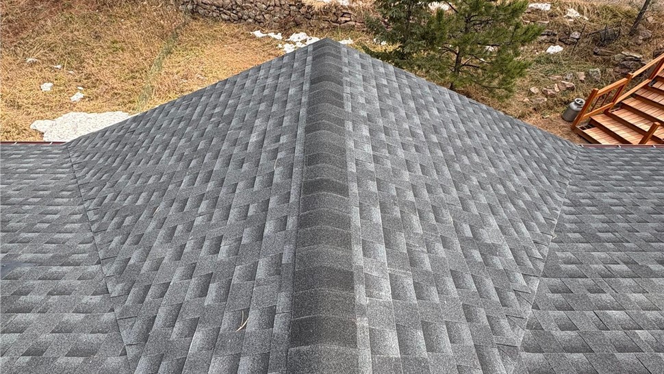 Wide angle view of GAF Timberline Armorshield II in Charcoal with upgraded ventilation on a home in Lyons Colorado