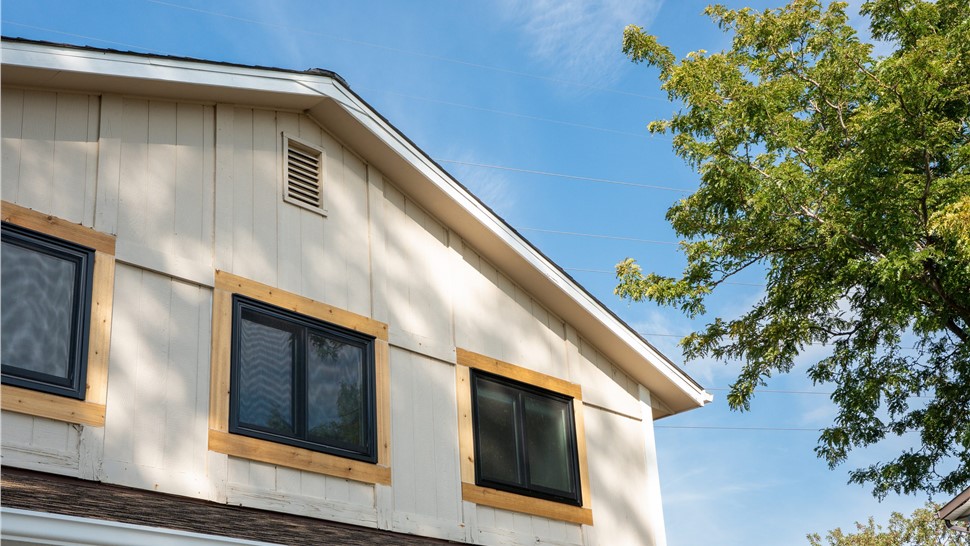 Original tan T1-11 siding on a Westminster, CO home before replacement