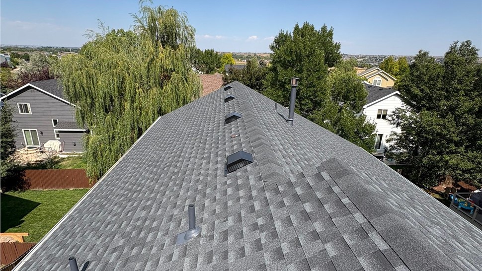 wide angle view of complete roof replacement with GAF Armorshield II shingles in Charcoal on home in Erie Colorado
