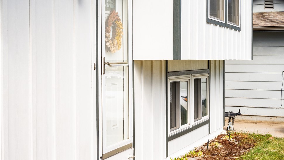 Golden, Colorado home after a full James Hardie Board and Batten Reside in Arctic White with Iron Gray trim