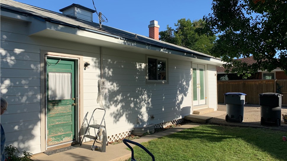 New lap siding and rear entry with green door, Longmont, CO