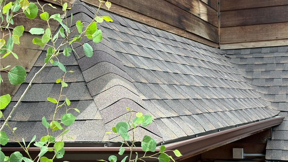 Hip and ridge line detail of new GAF ArmorShield II roofing in Barkwood