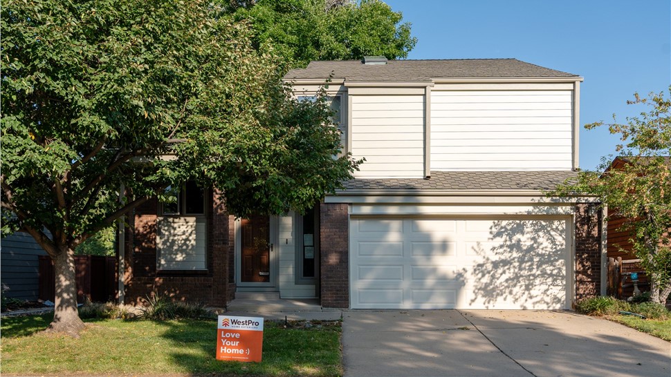 Completed James Hardie siding installation with Navajo Beige lap siding in Louisville Colorado