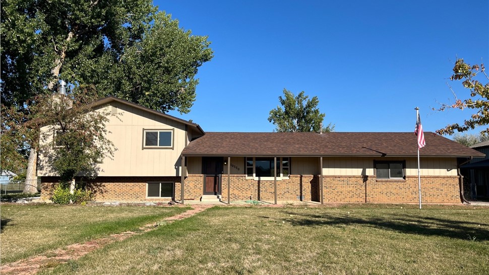 Longmont home before James Hardie siding installation and GAF Roof System