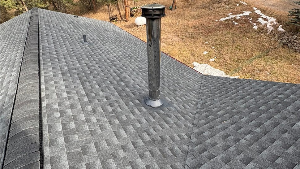 Wide angle view of GAF Timberline Armorshield II in Charcoal with upgraded ventilation on a home in Lyons Colorado
