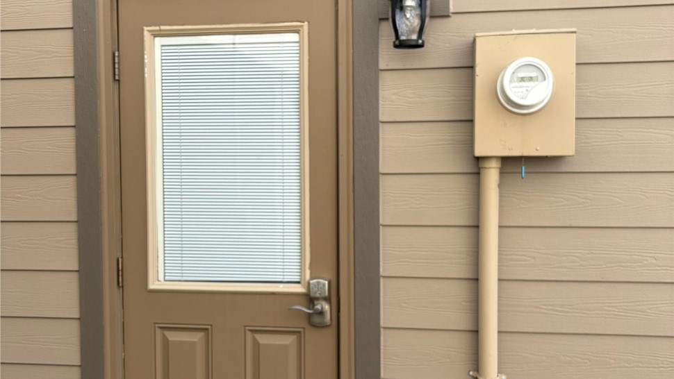 Detailed shot of timber bark trim view of completed James Hardie Lap siding install in Louisville Colorado