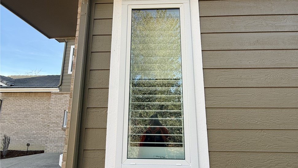 New Pella Impervia picture window installed on siding in Longmont Colorado