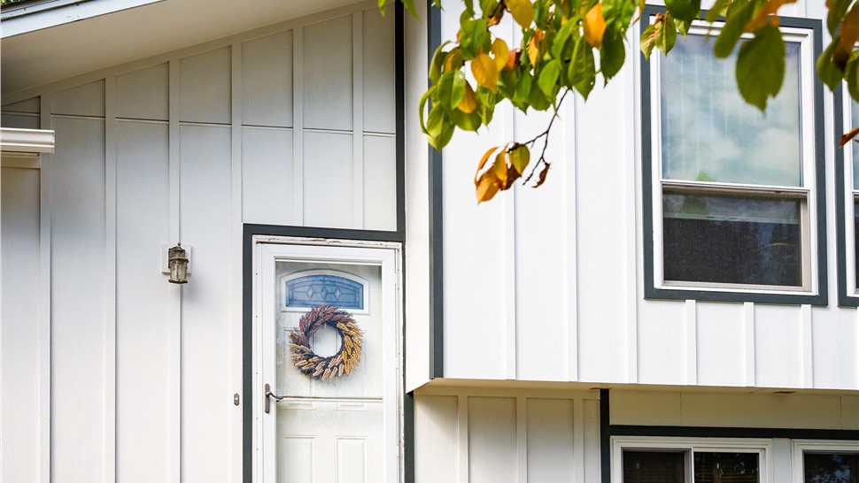 Golden, Colorado home after a full James Hardie Board and Batten Reside in Arctic White with Iron Gray trim