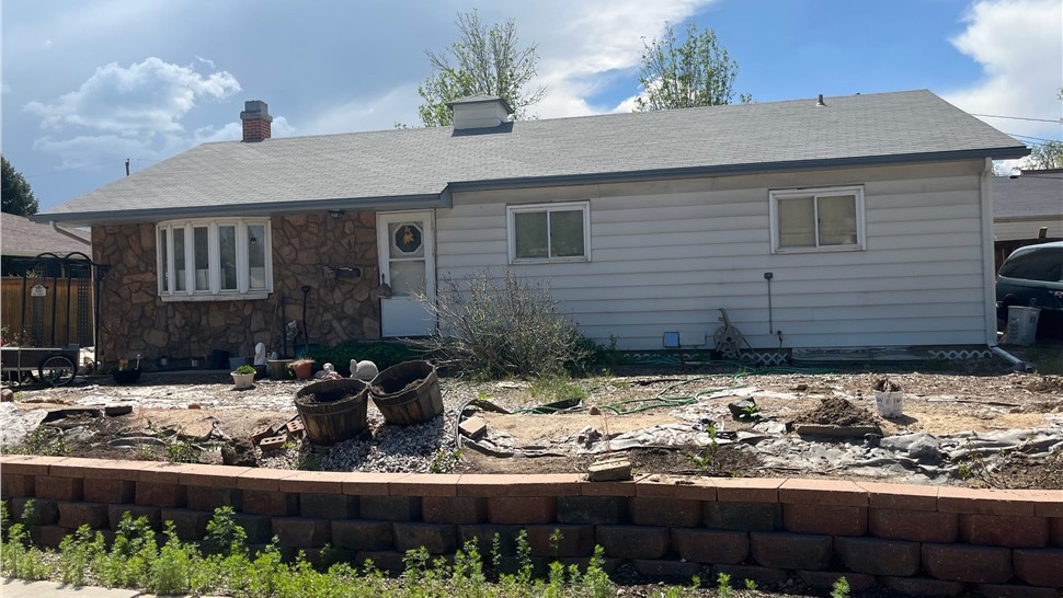 New lap siding and rear entry with green door, Longmont, CO