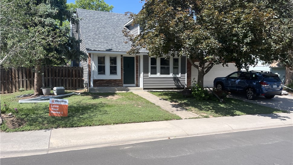 Full front elevation of a Fort Collins home with new James Hardie siding in Aged Pewter